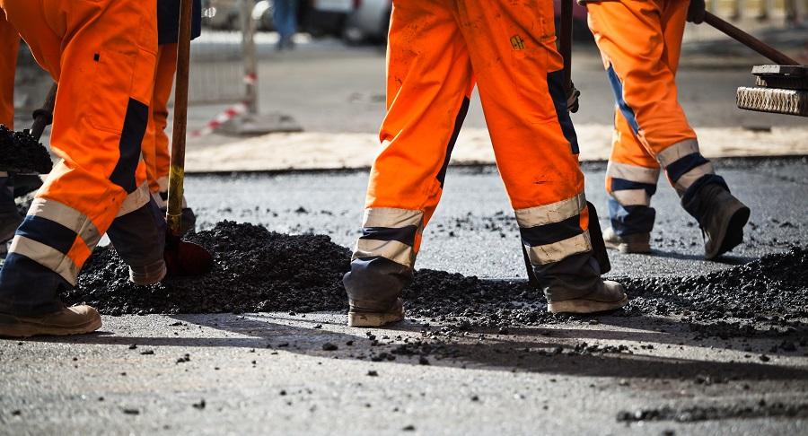 Legs of road workers