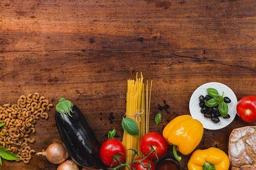 selection of vegetables including peppers, tomatoes, onions and aubergine