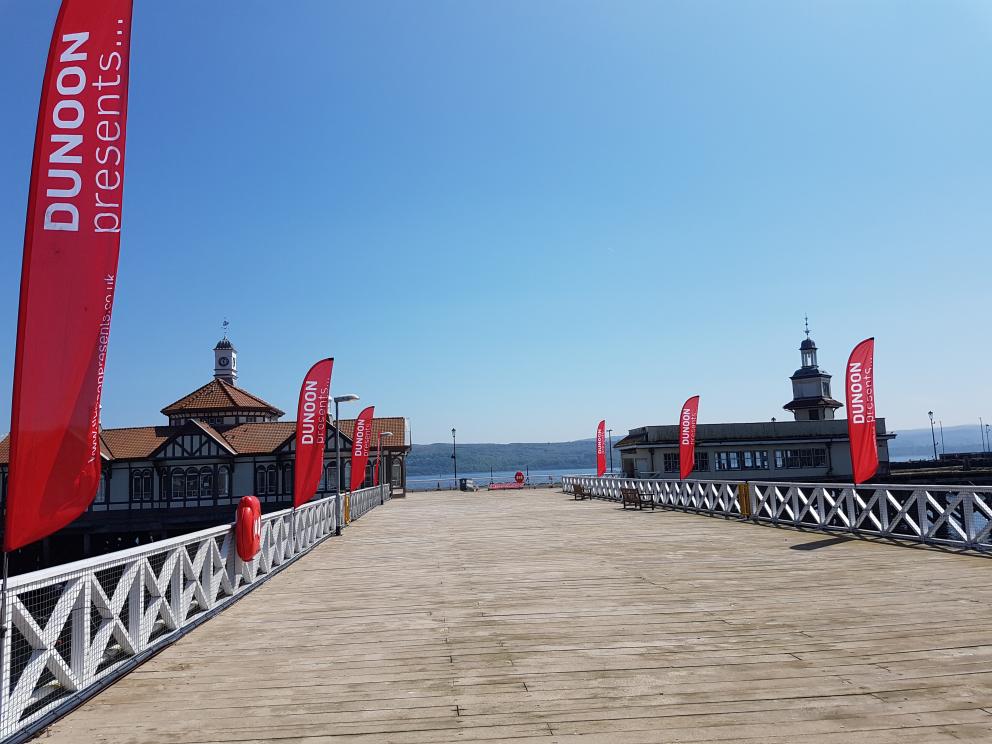 Dunoon Pier with Dunoon Presents' flags