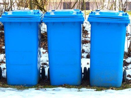 three blue wheelie bins