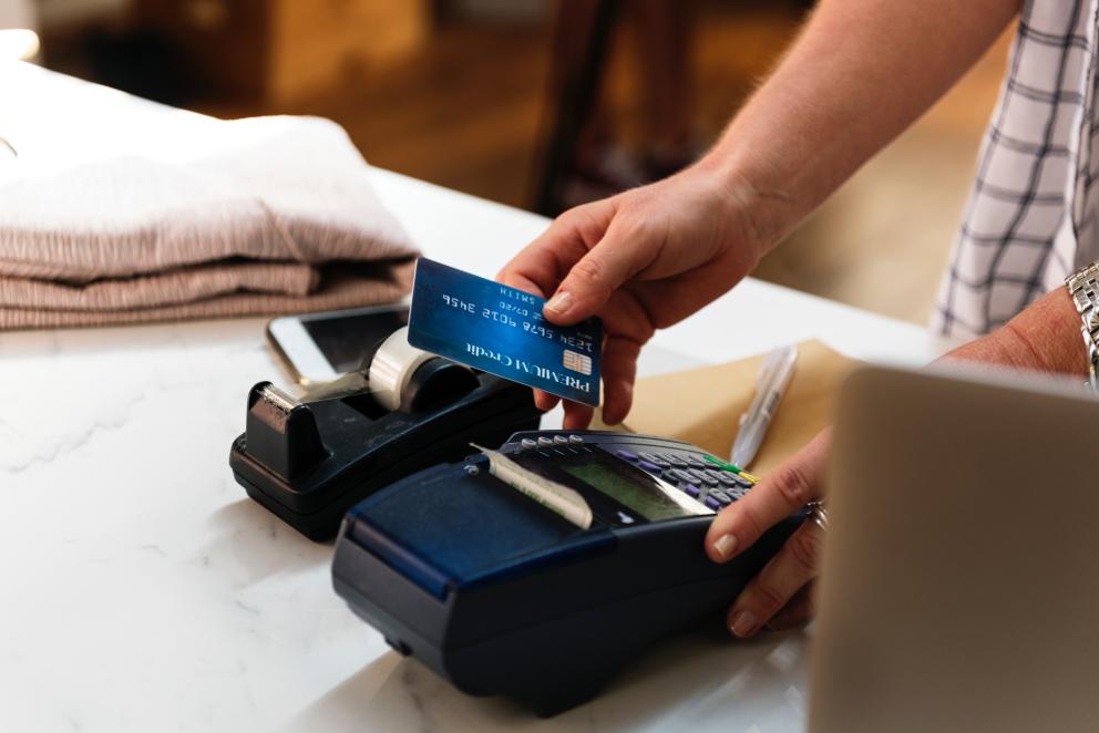 picture of a person using a credit card