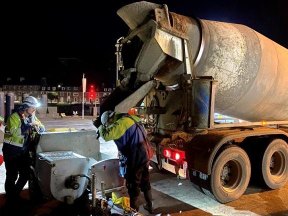 a concrete mixer pouring concrete