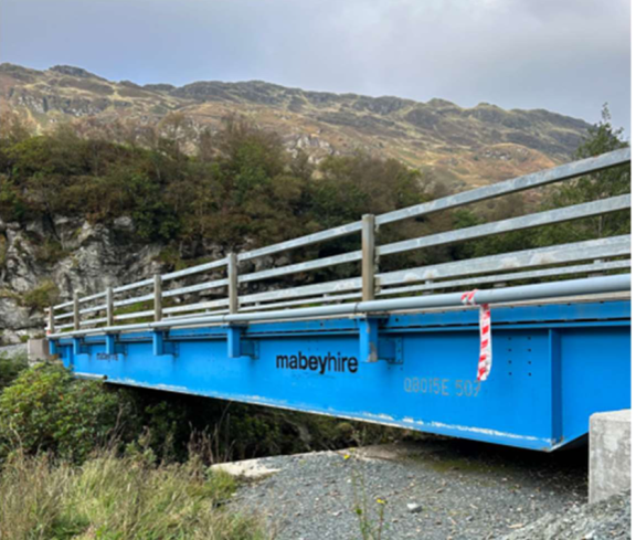 Conduit has been placed along the temporary bridge