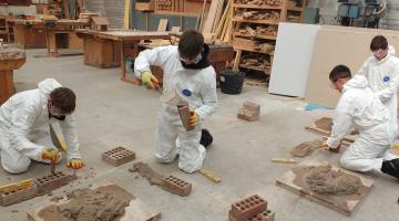 Pupils trying their hand at brickwork 