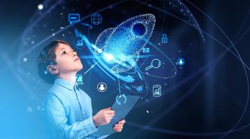 boy looking up at blue hologram of rocket