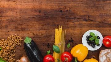 selection of vegetables including peppers, tomatoes, onions and aubergine