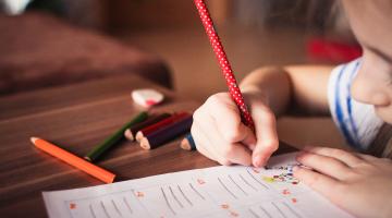 A photo of a school child in class