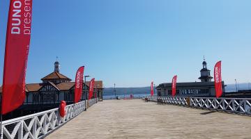 Dunoon Pier with Dunoon Presents' flags