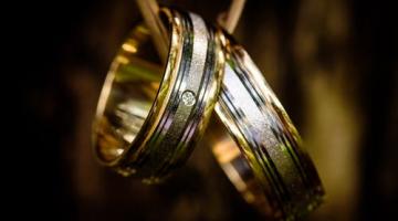 Two gold and silver wedding rings