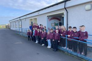 Image shows children from Drumlemble Primary School and ELC achieving their silver award