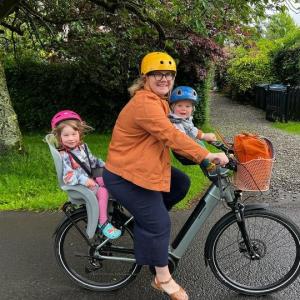 Mairi Queen from Helensburgh cycling to nursery with her two children onboard